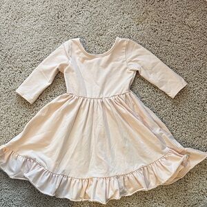 Little Stocking Co Cream twirl Dress with Ruffle Hem